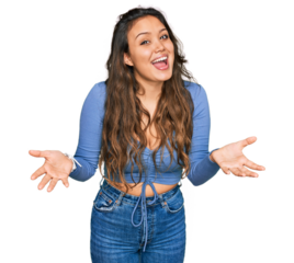 Young hispanic girl wearing casual clothes smiling cheerful offering hands giving assistance and acceptance.