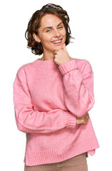 Young hispanic woman wearing casual clothes looking confident at the camera smiling with crossed arms and hand raised on chin. thinking positive.