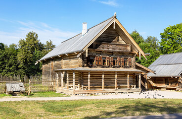 Retro wooden house at the russian village in summer sunny day. Vitoslavlitsy village