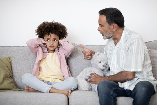 Senior Grandpa Scolding Naughty Grandchild Boy For Misbehavior At Home