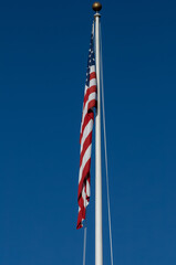 American Flag and Blue Sky at Punchbowl Cemetery in Hawaii.