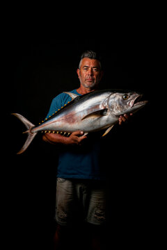 Proud Fisherman Showcasing a Large Catch Generative AI image