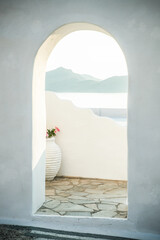 traditional Greek door opening to the sea