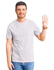 Handsome young man with bear wearing casual tshirt showing and pointing up with fingers number four while smiling confident and happy.
