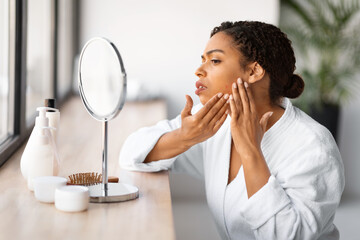 Skin Problems. Stressed Black Woman Looking In Mirror At Pimples On Cheek