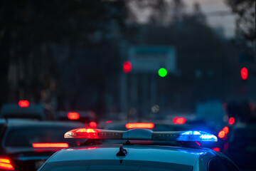 Police car in evening traffic