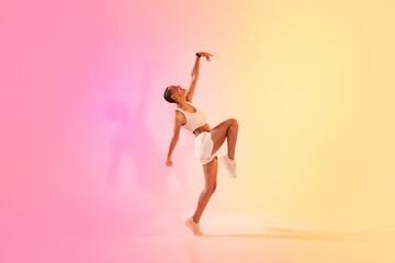 An exuberant young dancer in a dynamic pose captures the essence of movement and grace