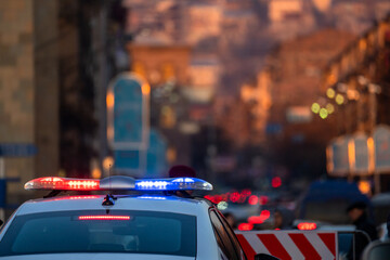 Police car in evening traffic