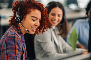 Customer services latino woman agent with headset working in an office