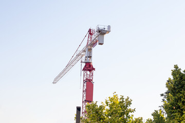 Building crane on the construction site with a clear sky