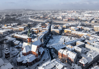 Panorama of snow covered Podgorze district (Podgorski Square with St. Joseph's Church) in Krakow, Poland