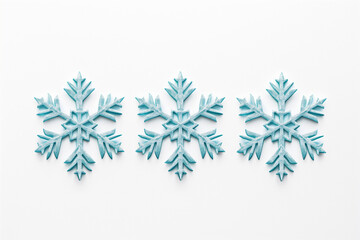 The image shows three distinct snowflake designs with a light blue hue, presented in a row against a white background