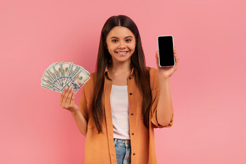 Happy Teen Girl Holding Blank Smartphone And Dollar Cash In Hands
