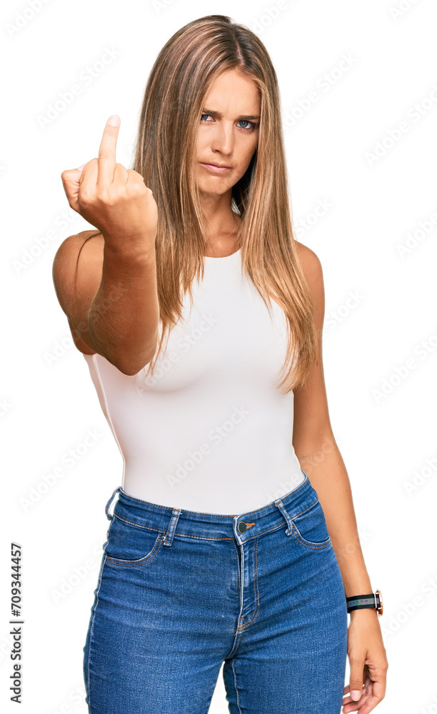 Wall mural young blonde woman wearing casual style with sleeveless shirt showing middle finger, impolite and ru - Wall murals