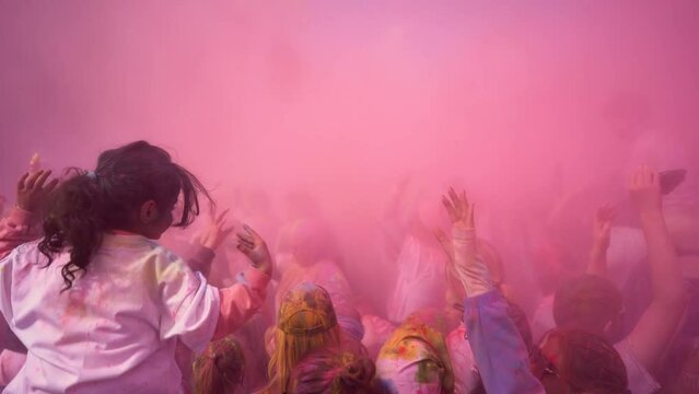 People celebrating holi festival with colors. Holi is a festival of India. 