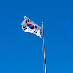 Korean National Flag Flying Under the Blue Sky