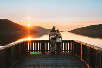 Couple man and woman hugging  Valentines day family enjoying sunset lake view together travel...