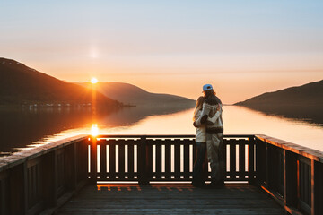 Hugging couple in love enjoying sunset view together Valentines day holiday family relationship man and woman standing on pier outdoor travel romantic lifestyle dating on lake - Powered by Adobe