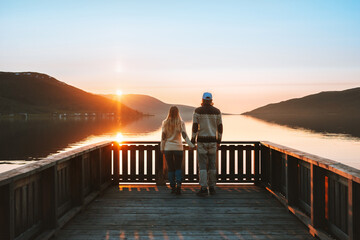 Couple in love walking together Valentines day family travel lifestyle romantic relationship man and woman holding hands dating outdoor sunset lake and mountains landscape - Powered by Adobe