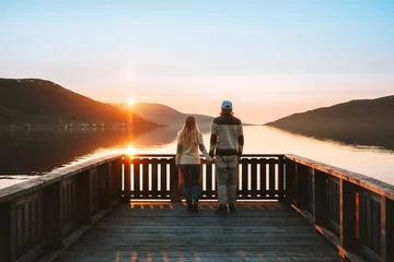  Couple in love walking together Valentines day family travel lifestyle romantic relationship man and woman holding hands dating outdoor sunset lake and mountains landscape © EVERST
