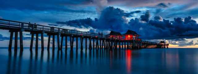 Foto auf Acrylglas famous old bridge in florida - travel concept of famous pier near naples in florida usa at sunset - travel concept © emotionpicture