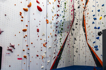 Indoor bouldering and climbing wall for training at a modern gym © Renata