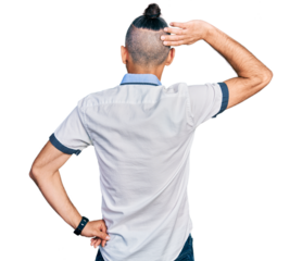 Hispanic man with ponytail wearing casual white shirt backwards thinking about doubt with hand on head