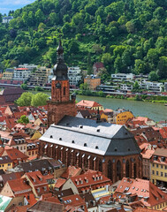 Church of the Holy Spirit in Heidelberg Old Town, Germany. View from the lower slope of Konigstuhl hill. The church was constructed between 1398 and 1515. - 709350684