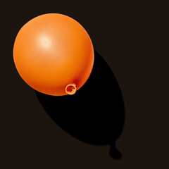 Orange balloon on black background - 709356640