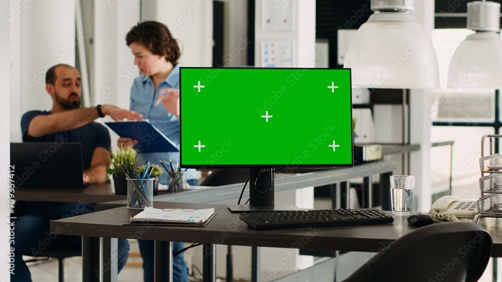 Poster computer with blank greenscreen running in small business agency. chromakey with isolated display an