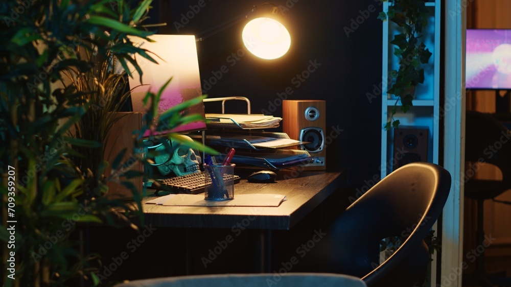 Poster revealing shot of computer screens showing running animation rendering in dimly lit empty home inter
