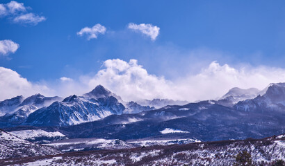 Fototapeta na wymiar Colorado, Dallas Divide, Mt .Snuffles snow covered mountains in winter high winds 