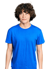 Fototapeta na wymiar Caucasian teenager wearing casual clothes smiling looking to the side and staring away thinking.