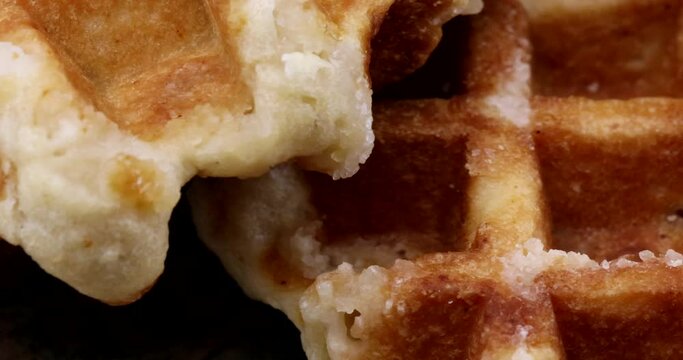 Macro video with sugar waffles on rotating breakfast plate