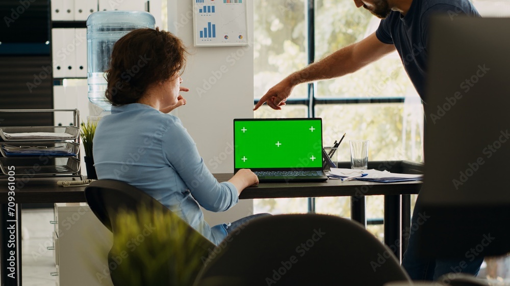Poster startup team checking greenscreen app on laptop layout, brainstorming new budget ideas and working o