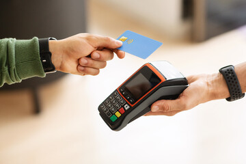 Cropped of man customer paying with credit card
