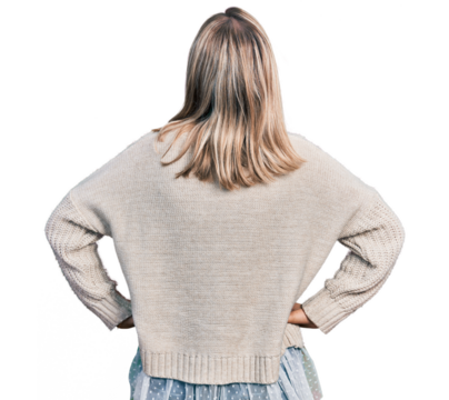 Young blonde woman wearing glasses standing backwards looking away with arms on body