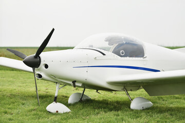 Mini white airplane at the airfield