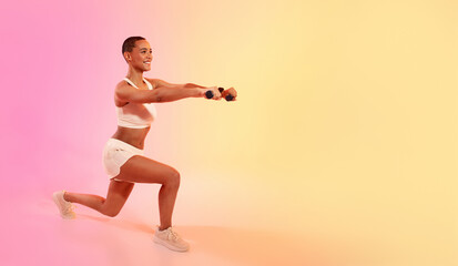 Fototapeta na wymiar Exuberant young woman doing a lunge and holding weights, smiling