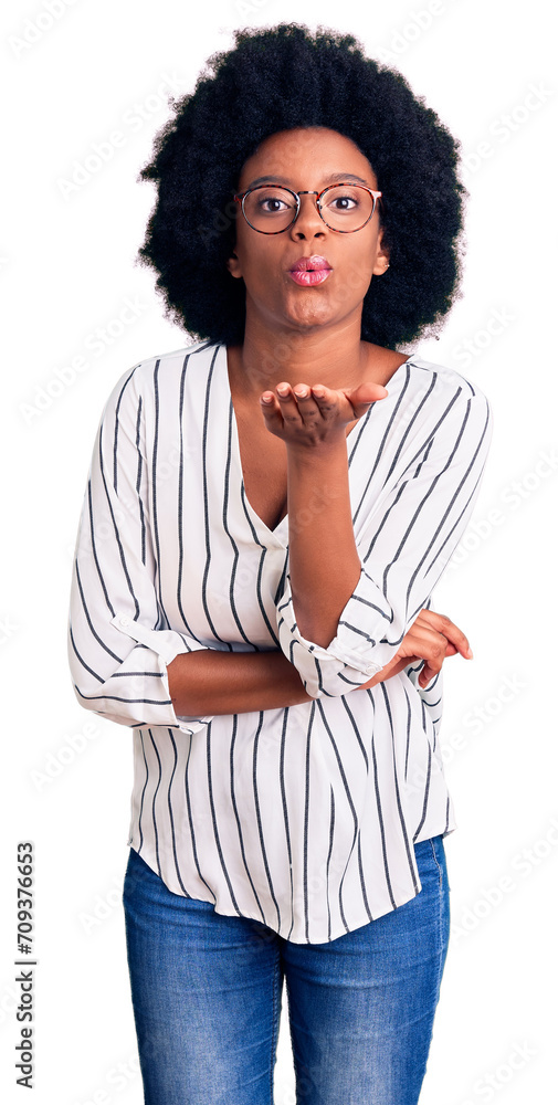 Poster Young african american woman wearing casual clothes and glasses looking at the camera blowing a kiss with hand on air being lovely and sexy. love expression.