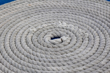 Fototapeta na wymiar Close up of Coiled Rope on a ships Deck