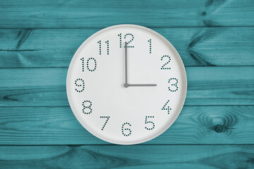 Three o'clock. Time management or business concept. Daytime. Plain white wall clock showing 2 pm on...