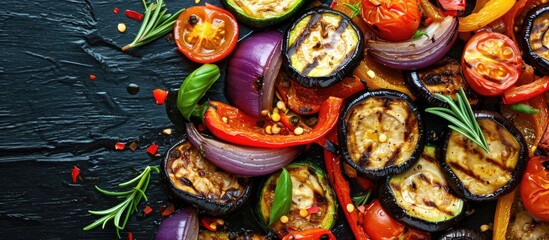 Grilled veggie salad with zucchini, eggplant, onion, pepper, and tomato.