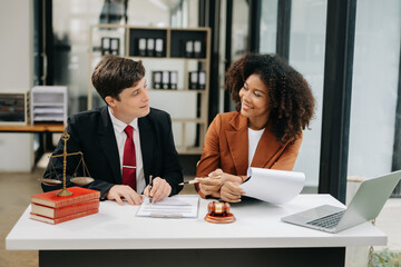 business people and lawyers discussing contract papers sitting at the table. Concepts of law, advice, legal services. in morning light.