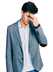 Young hispanic man wearing business clothes tired rubbing nose and eyes feeling fatigue and headache. stress and frustration concept.