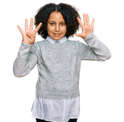 Young little girl with afro hair wearing casual clothes showing and pointing up with fingers number nine while smiling confident and happy.