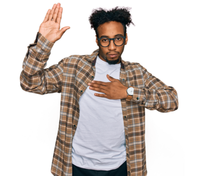 Young african american man with beard wearing casual clothes and glasses swearing with hand on chest and open palm, making a loyalty promise oath