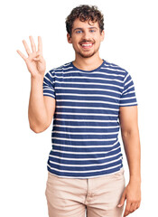 Young handsome man with curly hair wearing casual clothes showing and pointing up with fingers number four while smiling confident and happy.