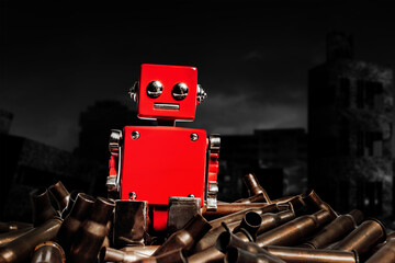 Photo of red robot sitting among a pile of bullet shells. Artificial intelligence war concept.