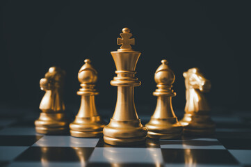 The set of golden chess pieces element is on the chalkboard.chess board game concept of business ideas and competition and stratagy plan success meaning